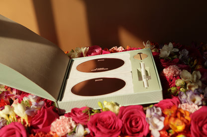 Prosperity Ritual Kit with rose gold glass mirror reflection cards, artisan incense paper, marker and recyled bamboo stand on bed of roses. mirror work, affirmation cards.